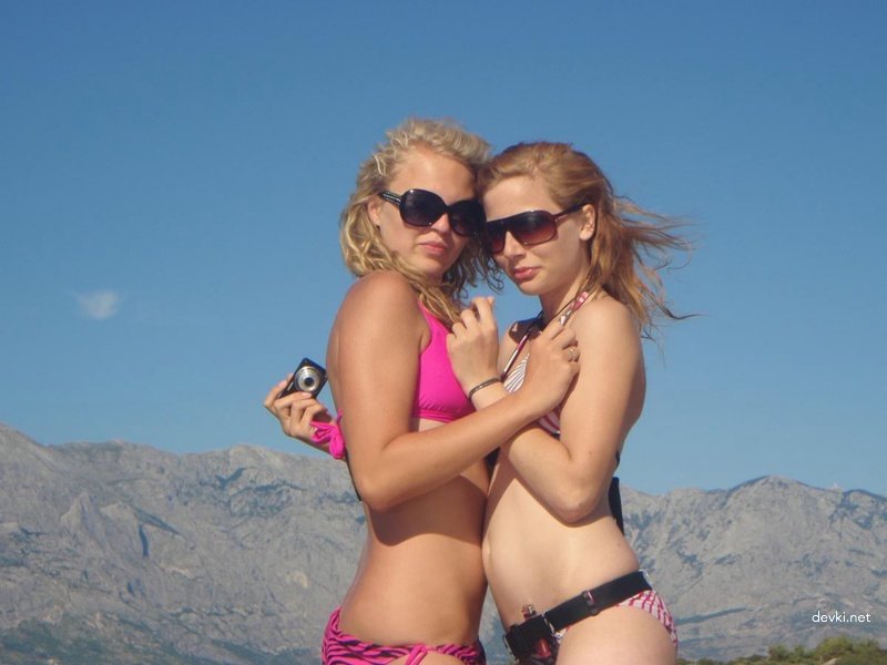 Best Friends at the Beach: Hot Bikini Babes Sunbathing and Having Fun