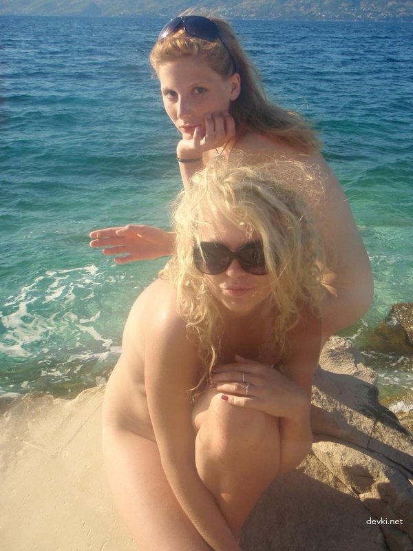 Best Friends at the Beach: Hot Bikini Babes Sunbathing and Having Fun