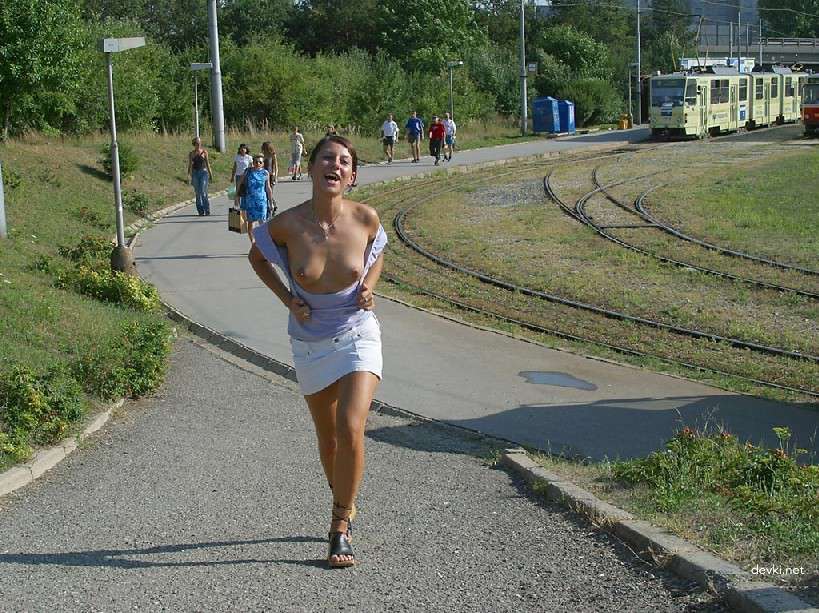 Naked Chick Struts Through City Streets - Explicit Public Nudity