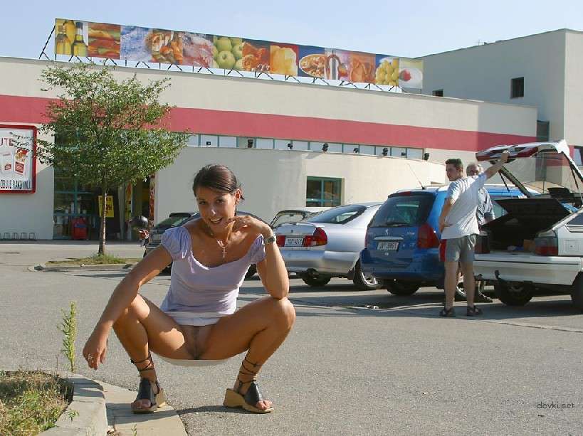 Naked Chick Struts Through City Streets - Explicit Public Nudity
