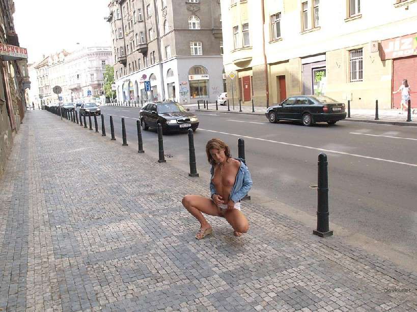Naked Chick Struts Through City Streets - Explicit Public Nudity