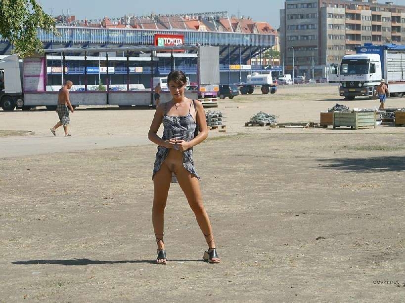 Naked Chick Struts Through City Streets - Explicit Public Nudity