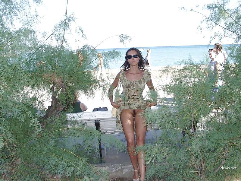 Naked girl sunbathing at the beach - Explicit and daring seaside relaxation