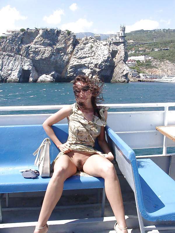 Naked girl sunbathing at the beach - Explicit and daring seaside relaxation