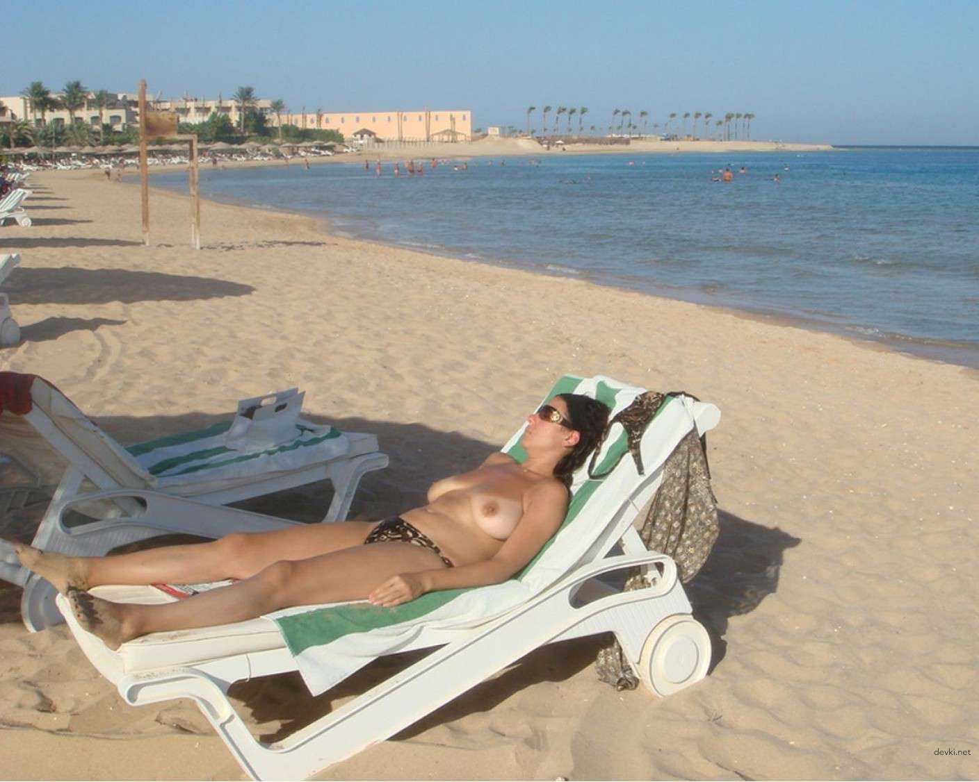 Sexy Busty Girl at the Beach - Explicit Big Boobs on Display