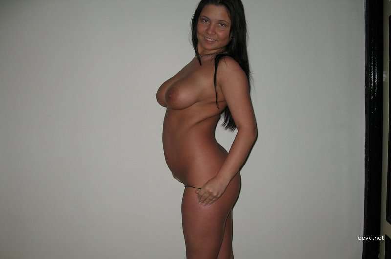 Brunette Poses Nude: Explicit Photoshoot with Naked Woman