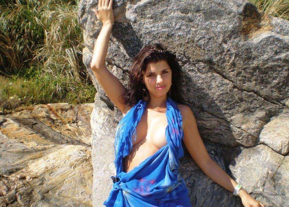Sexy Brunette Babe Sunbathing Topless on Vacation