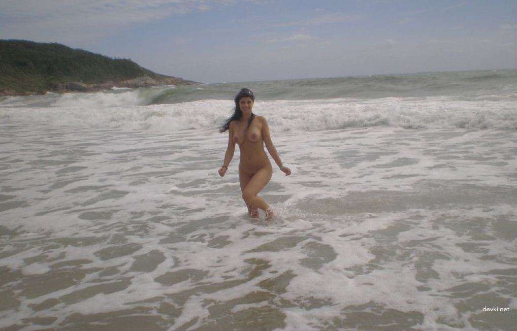 Sexy Brunette Babe Sunbathing Topless on Vacation
