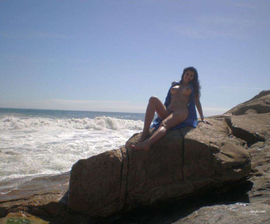 Sexy Brunette Babe Sunbathing Topless on Vacation