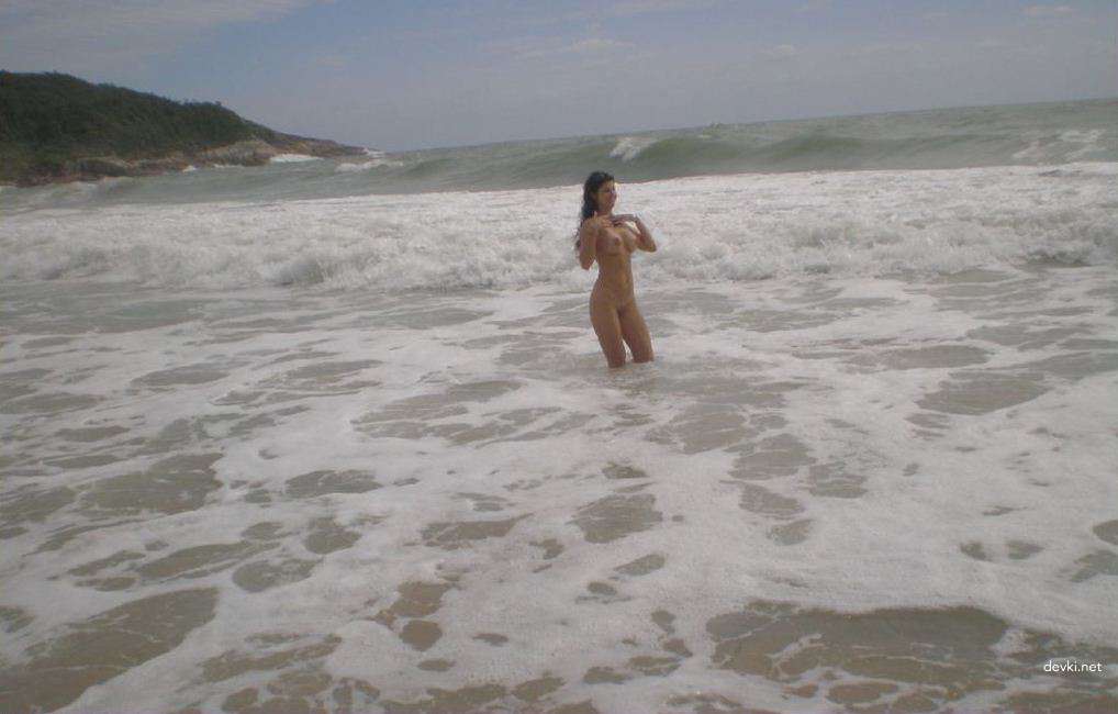 Sexy Brunette Babe Sunbathing Topless on Vacation