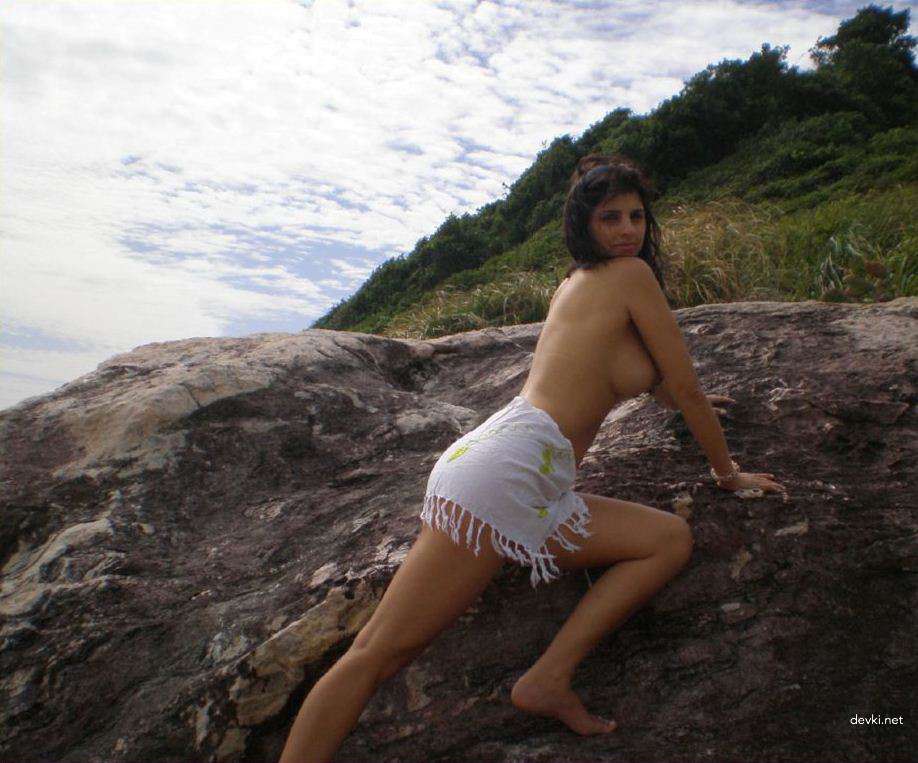 Sexy Brunette Babe Sunbathing Topless on Vacation