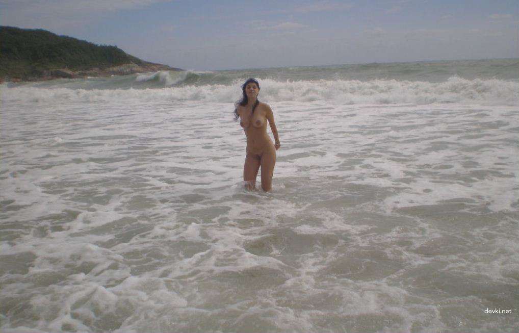 Sexy Brunette Babe Sunbathing Topless on Vacation