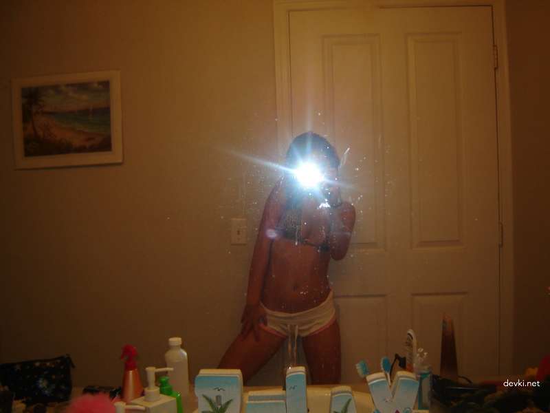 Sensual Brunette's Erotic Display: Seductive and Steamy Photoshoot