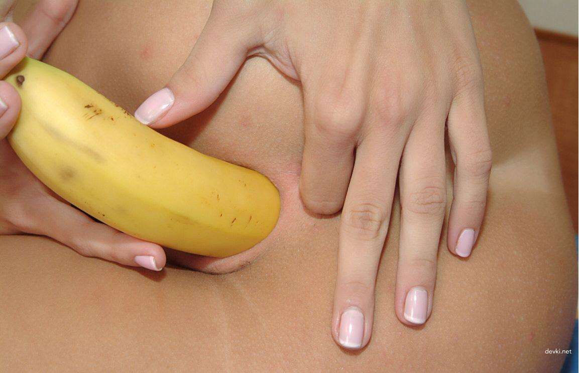 Busty babe fucks herself with banana in her tight ass