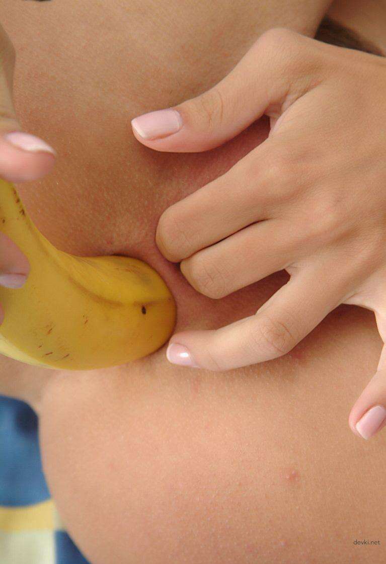 Busty babe fucks herself with banana in her tight ass