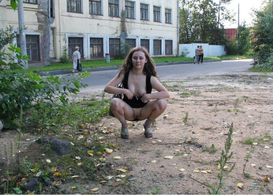Young girl on the street shows pussy - Explicit Public Display