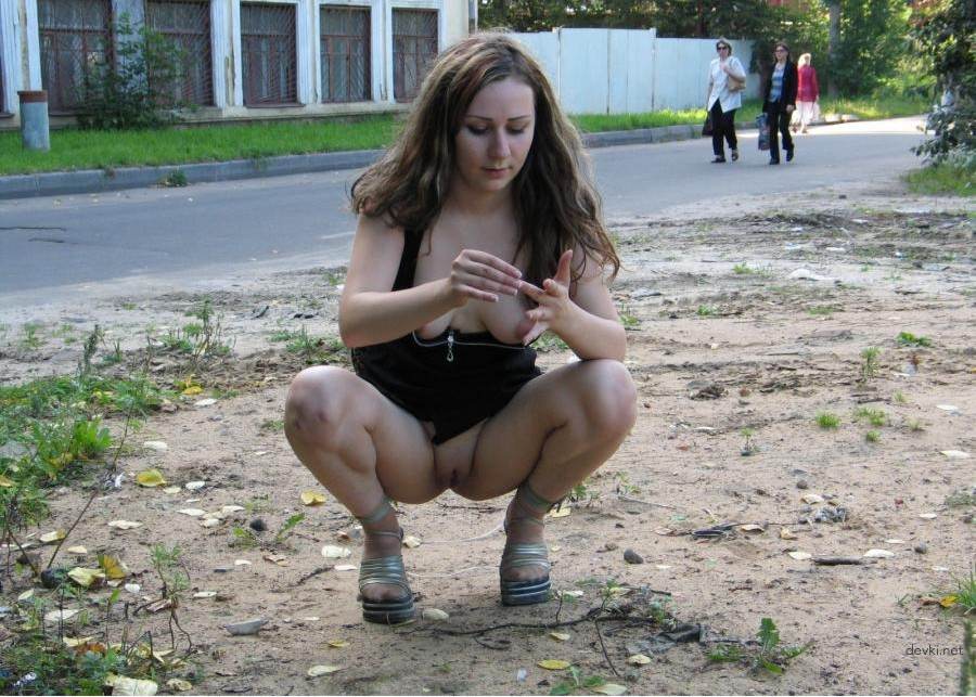 Young girl on the street shows pussy - Explicit Public Display