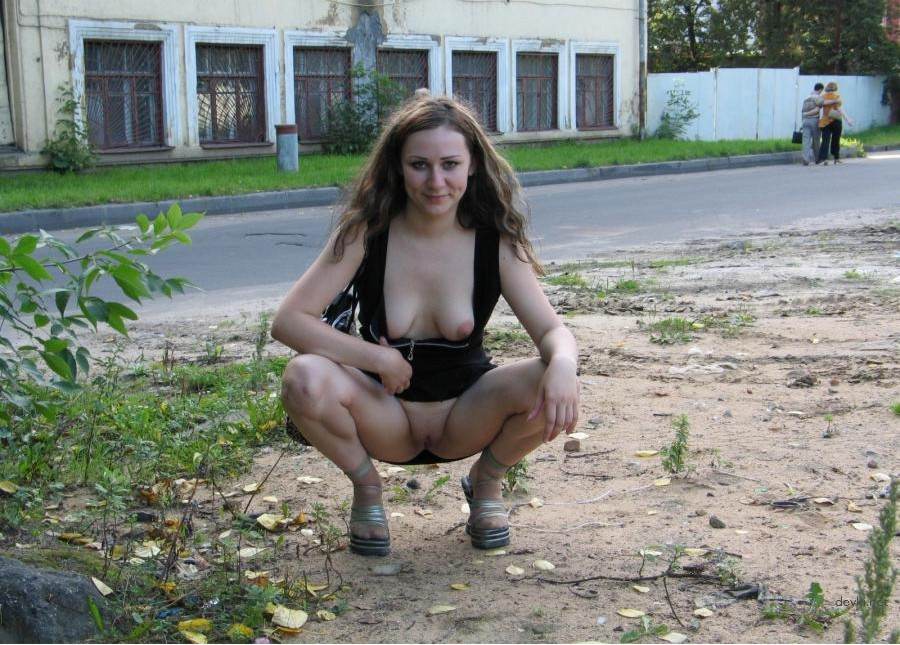 Young girl on the street shows pussy - Explicit Public Display
