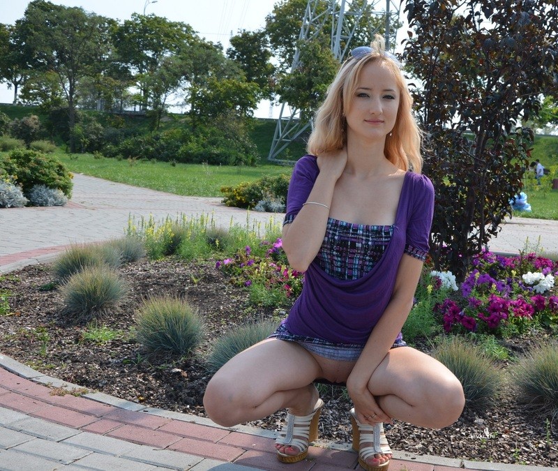 Seductive Long-Legged Woman Poses Provocatively on the Street