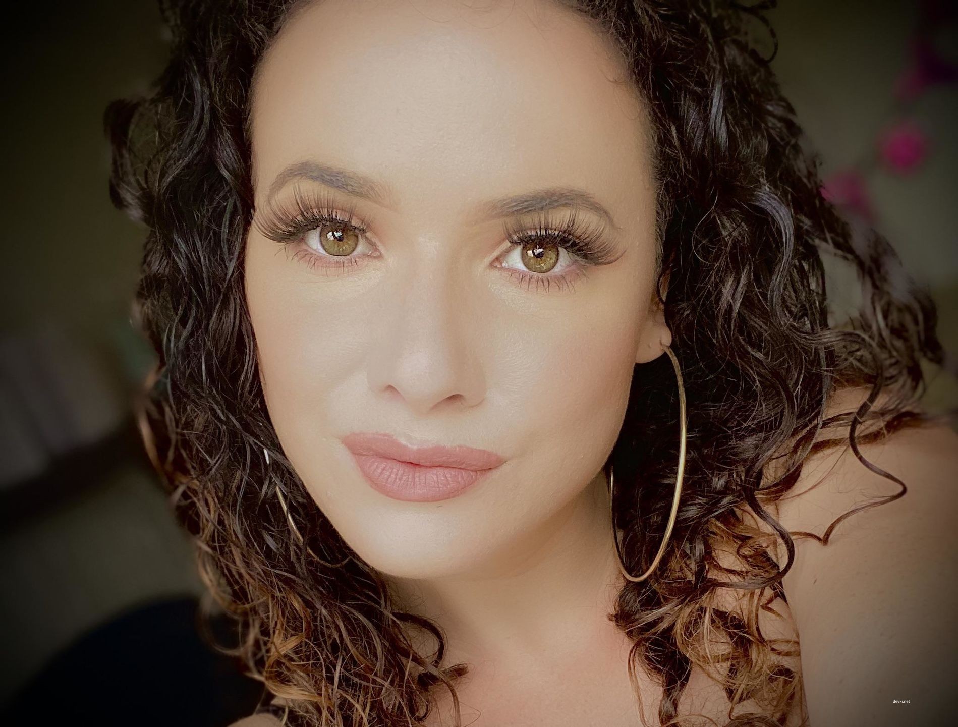 Sultry Dark-Haired Curly Beauty Exposing All in Provocative Pose