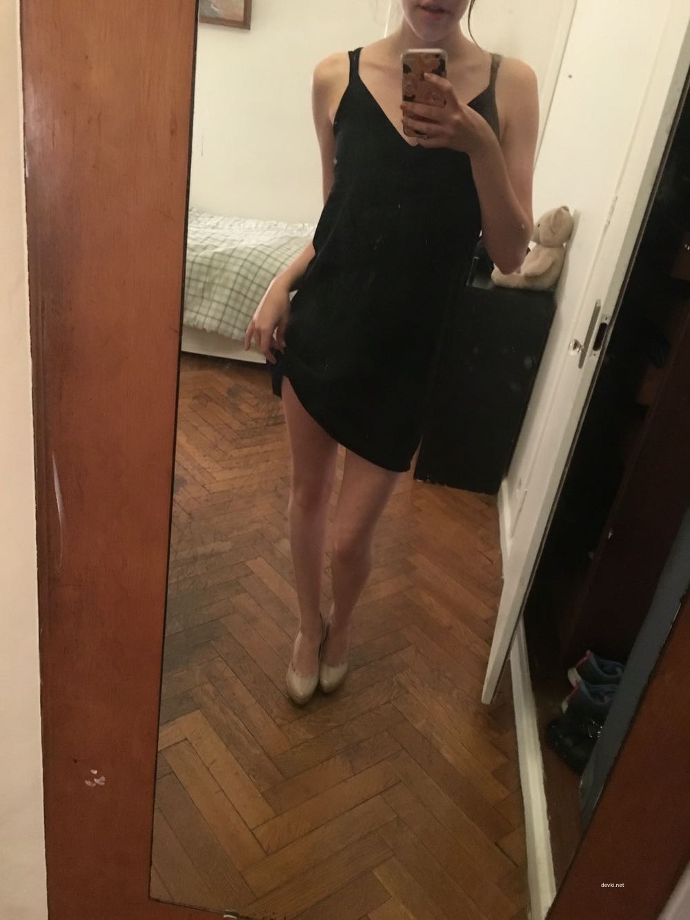 Explicit Nude Woman Standing in Front of Mirror