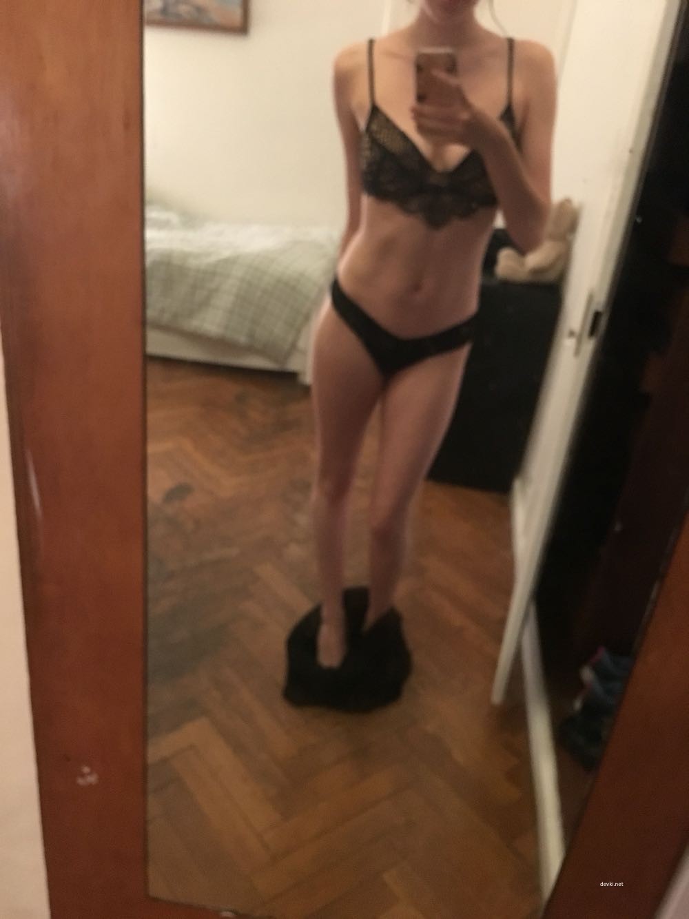 Explicit Nude Woman Standing in Front of Mirror