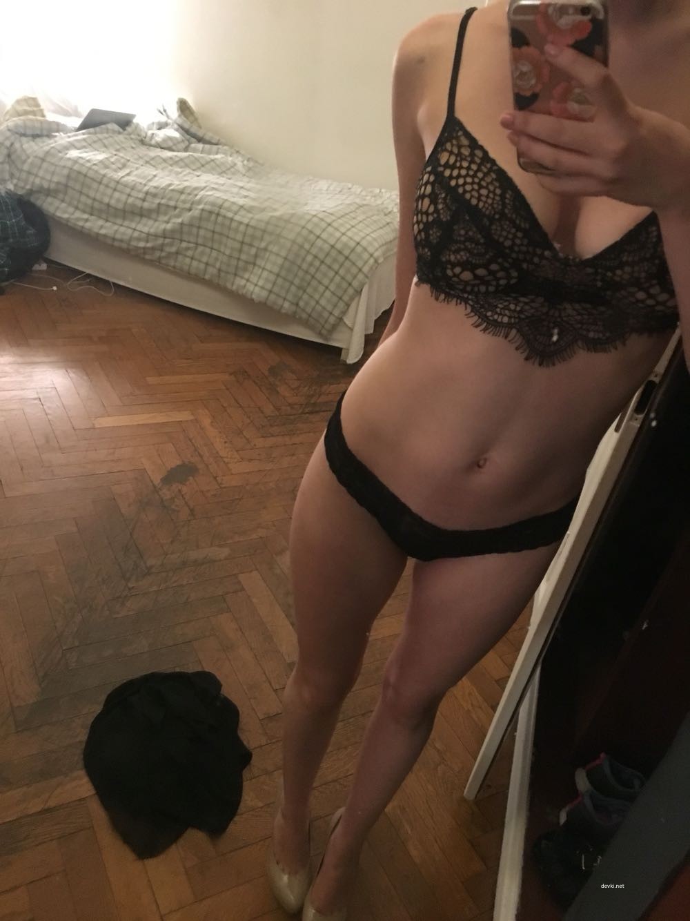 Explicit Nude Woman Standing in Front of Mirror