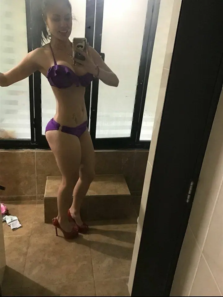 Sultry Woman with Stunning Figure Poses in Bikini: Hot and Curvy Beach Babe