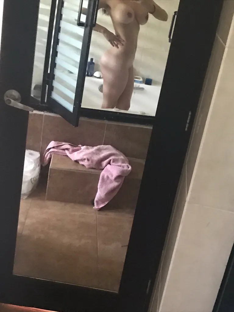 Sultry Woman with Stunning Figure Poses in Bikini: Hot and Curvy Beach Babe