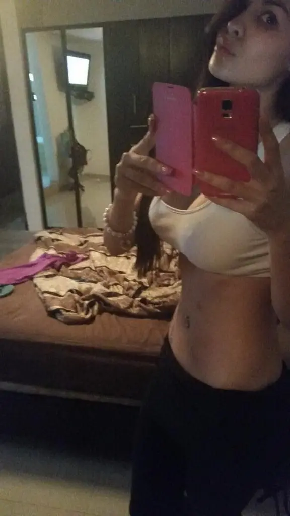 Sultry Woman with Stunning Figure Poses in Bikini: Hot and Curvy Beach Babe