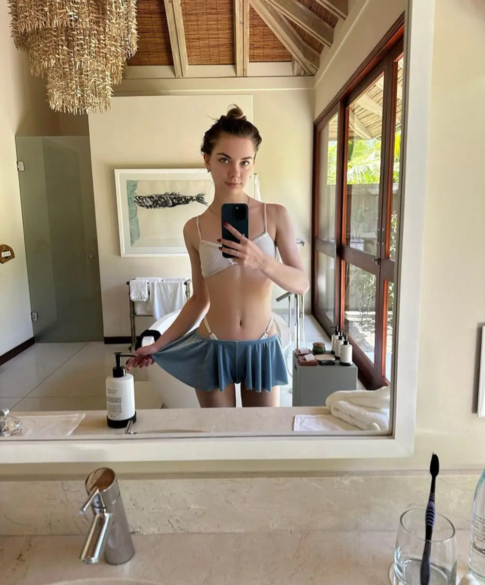 Sultry Beauty Relaxing: Hot Babe Sunbathing in Bikini