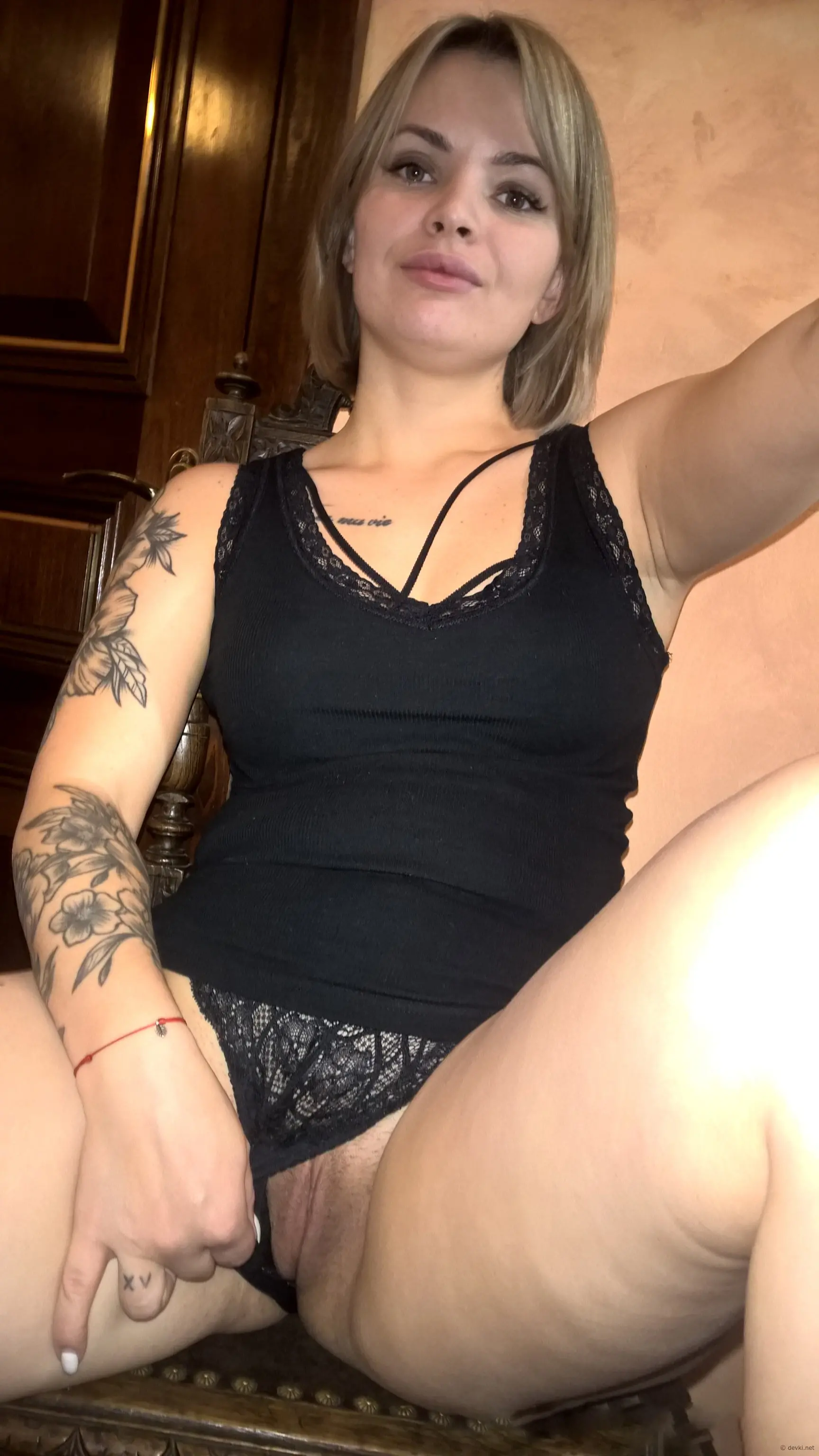 Sexy babe with short haircut flaunts perky tits in explicit display