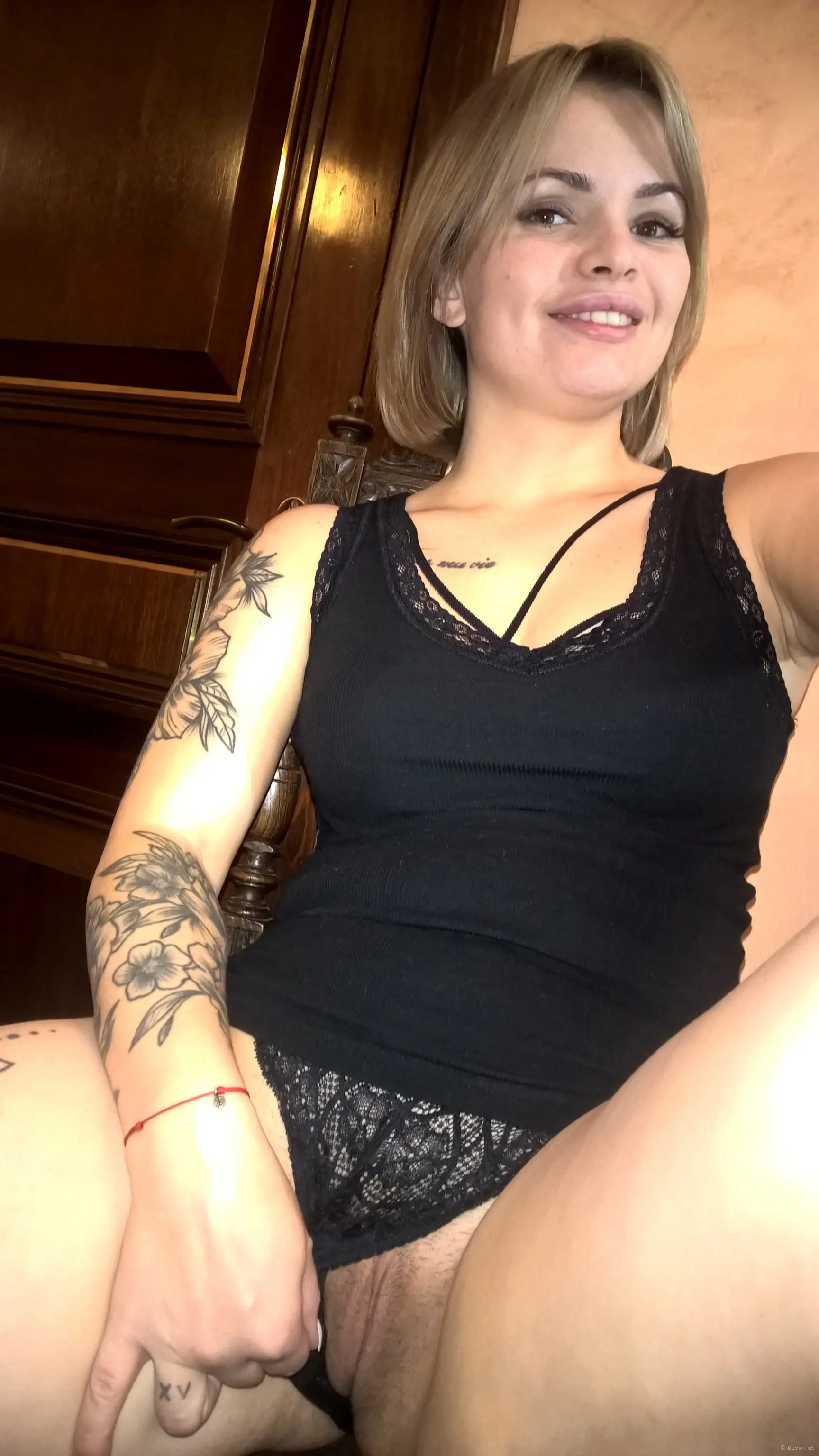Sexy babe with short haircut flaunts perky tits in explicit display