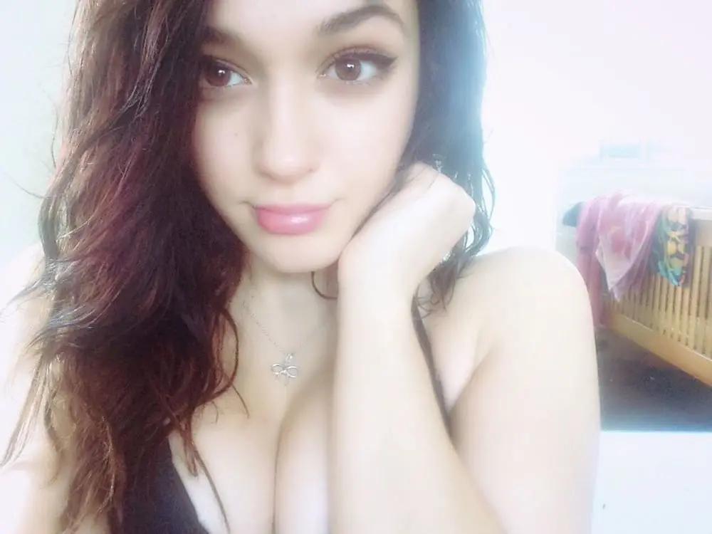 Amateur Photo of Cute Babe with Firm Tits and Shaved Pussy