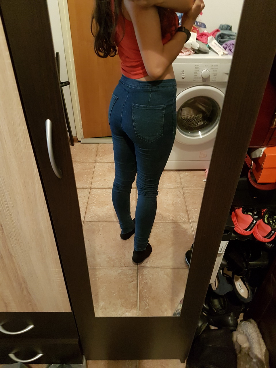 Brunette in tight jeans slowly strips completely naked