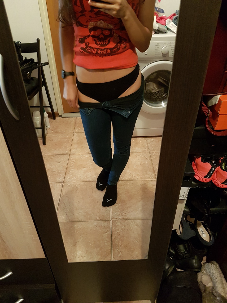 Brunette in tight jeans slowly strips completely naked