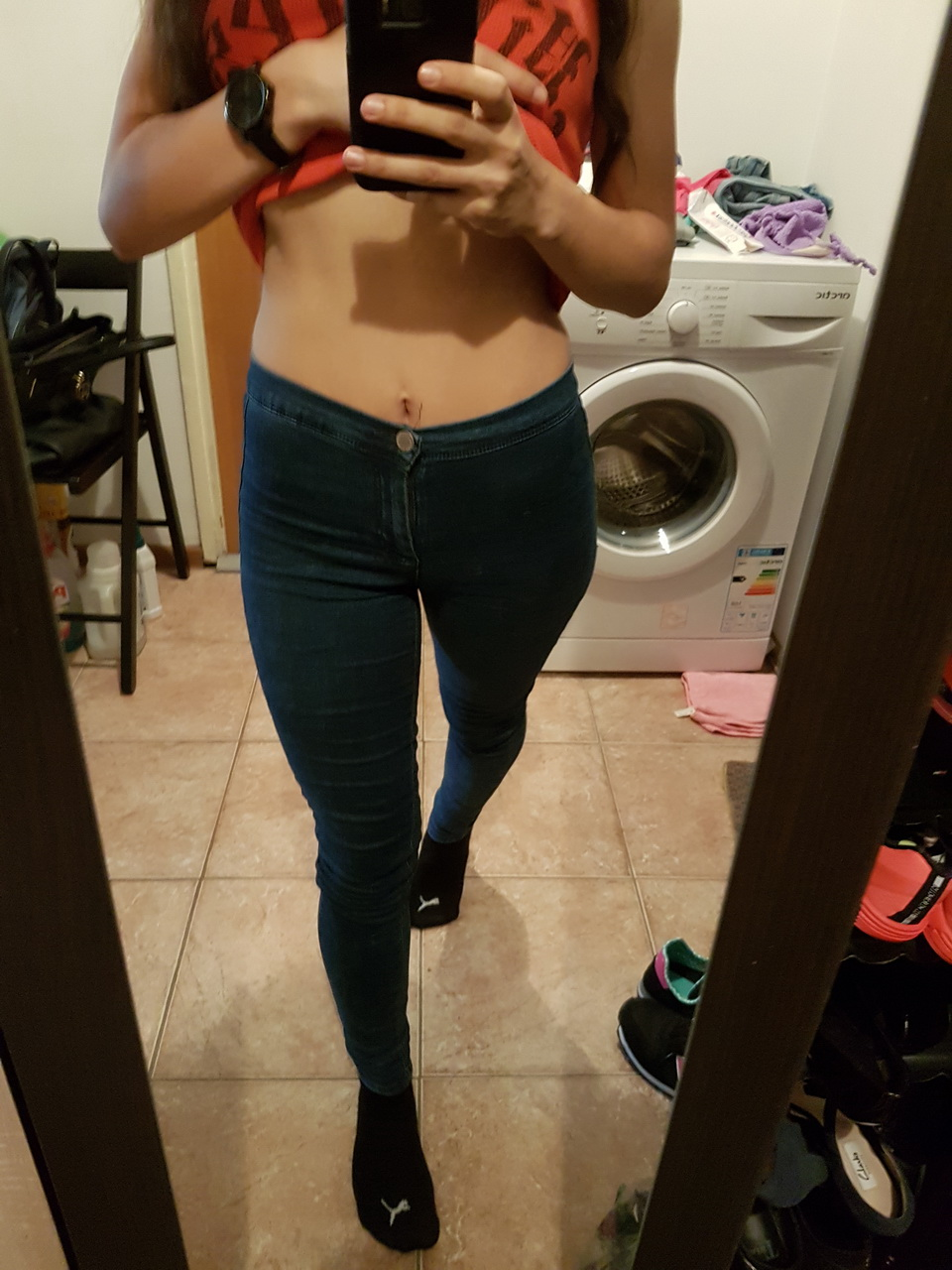 Brunette in tight jeans slowly strips completely naked