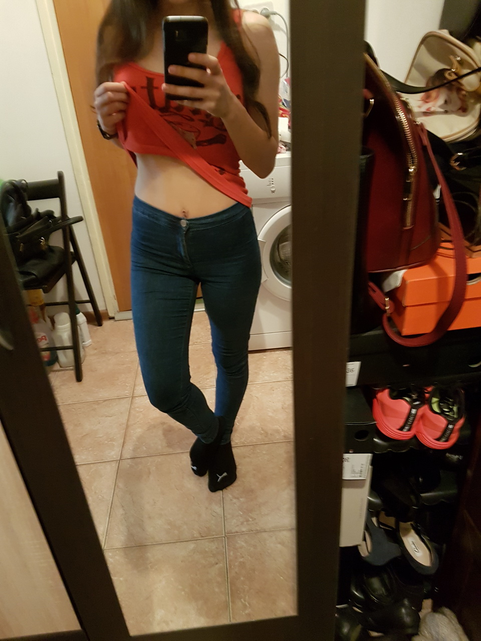 Brunette in tight jeans slowly strips completely naked