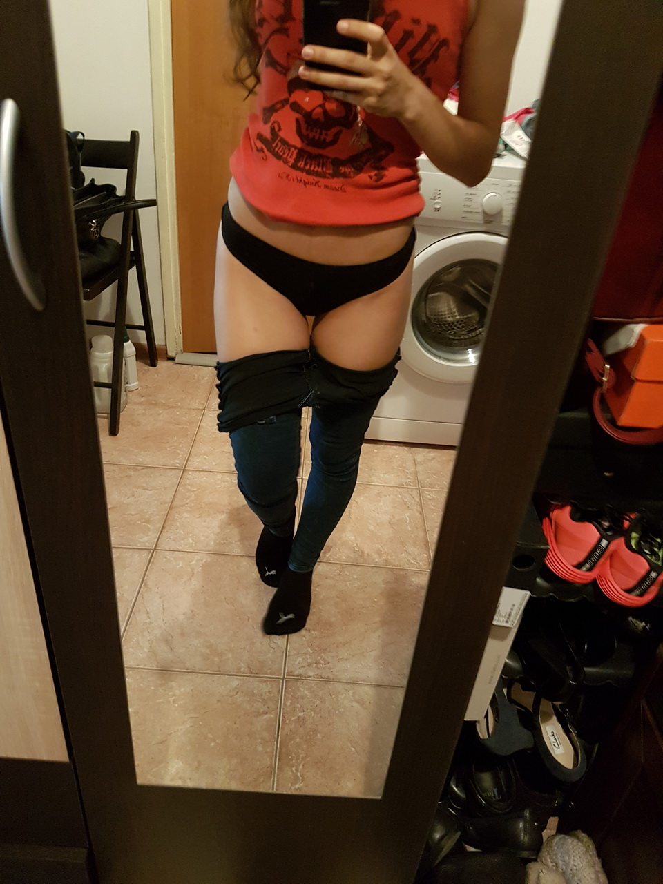 Brunette in tight jeans slowly strips completely naked