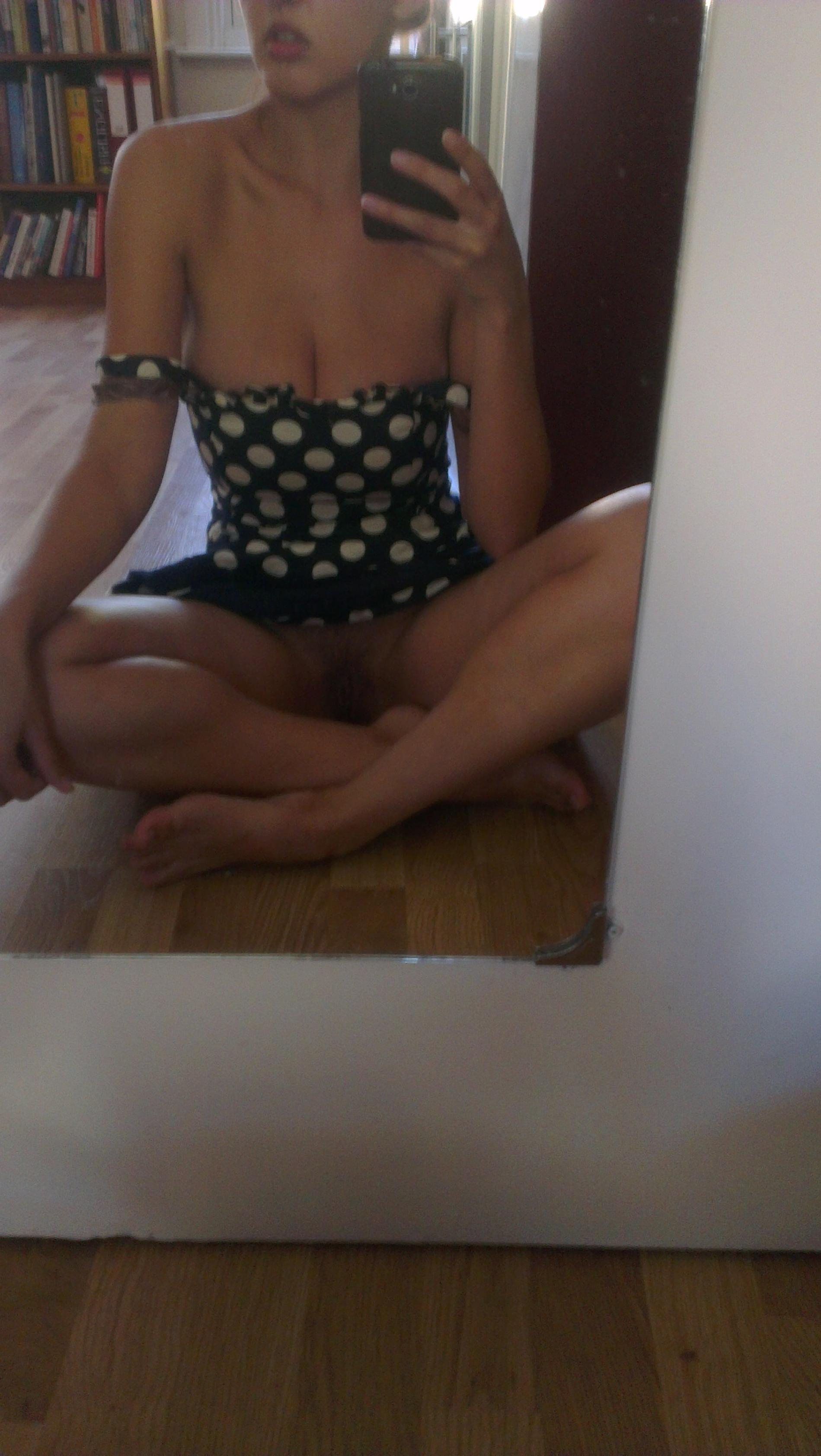 Busty babe flaunts naked in front of mirror in various panties
