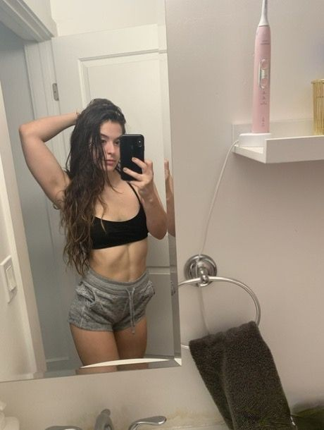 Young Brunette Selfies Exposing Holes and Hot Body on Smartphone – photo 1