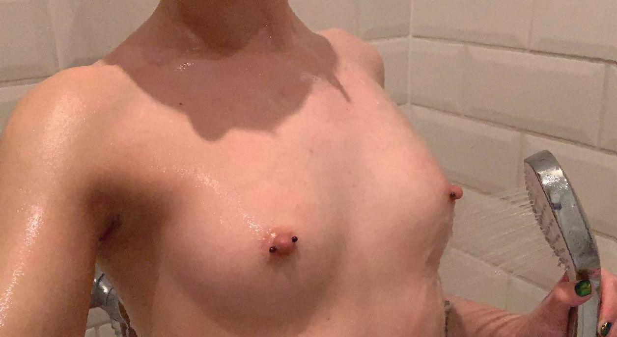 Explicit Intimate Photos of Young Girl with Tattoos and Nipple Piercings