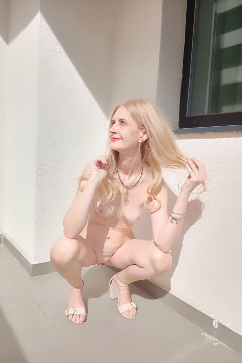 Free intimate photo of a busty milf with perky breasts