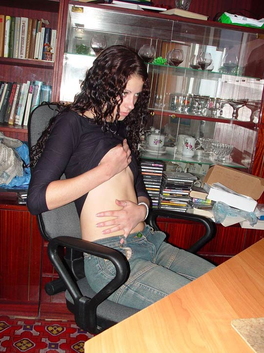 Girl relaxes in front of computer and unintentionally exposes herself