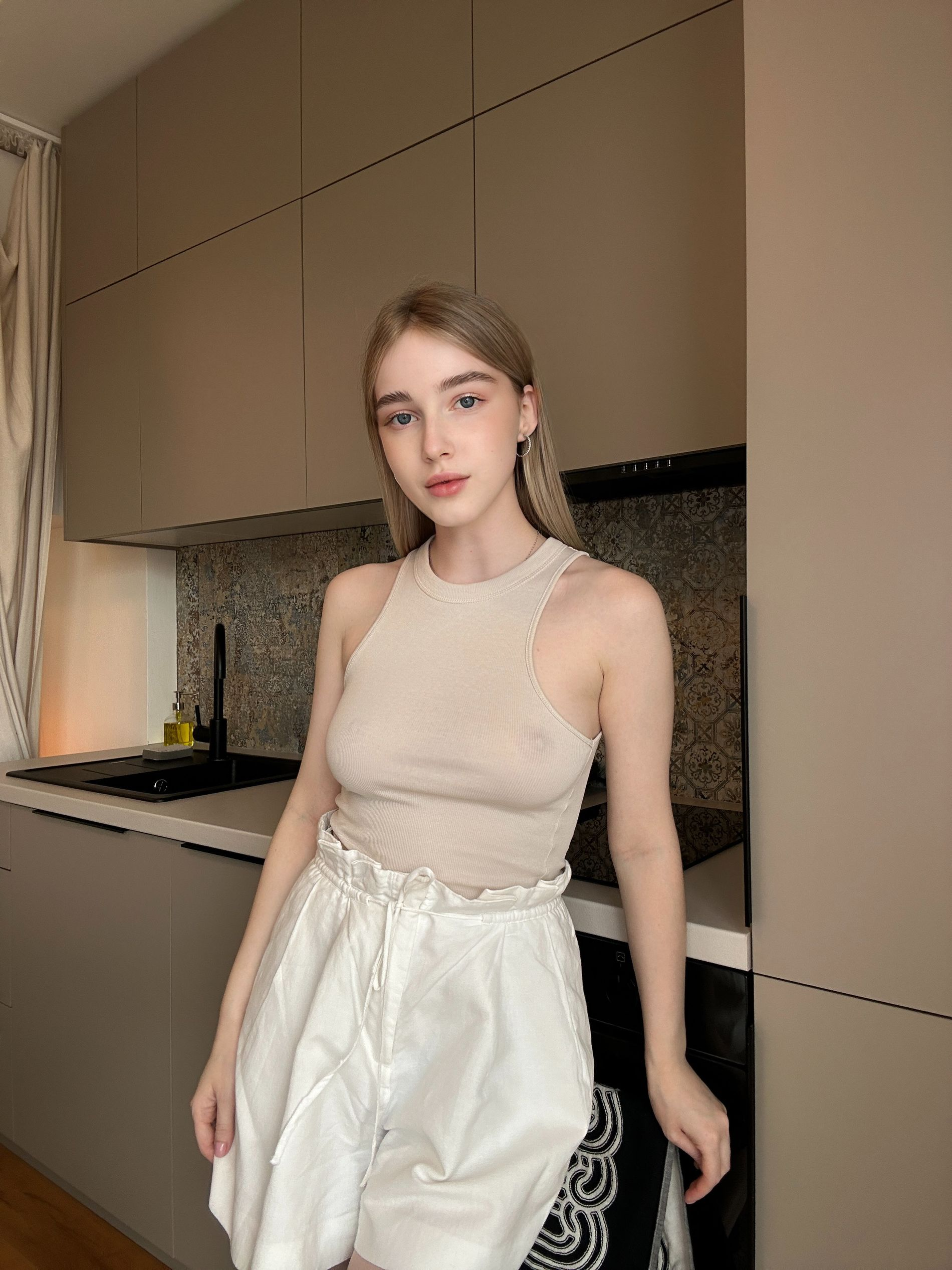 Sexy Young Blonde Shows Off Beautiful Breasts