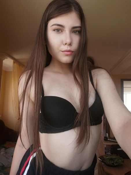 Young Brunette with Small Breasts Poses Nude for Explicit Photoshoot