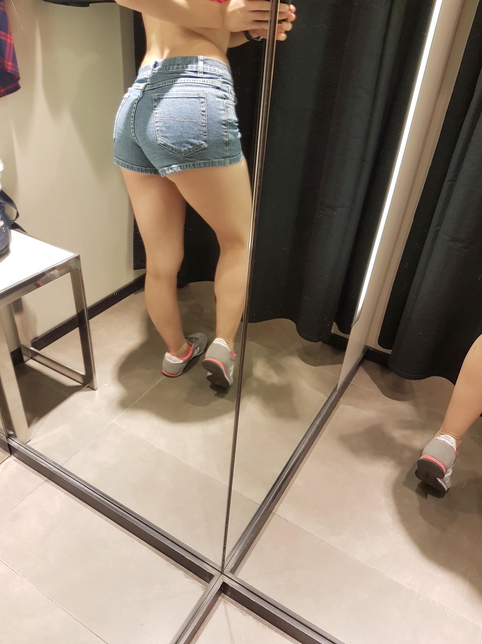 Spying in the mirror, I took off my shorts and showed off my wet panties and aroused pussy