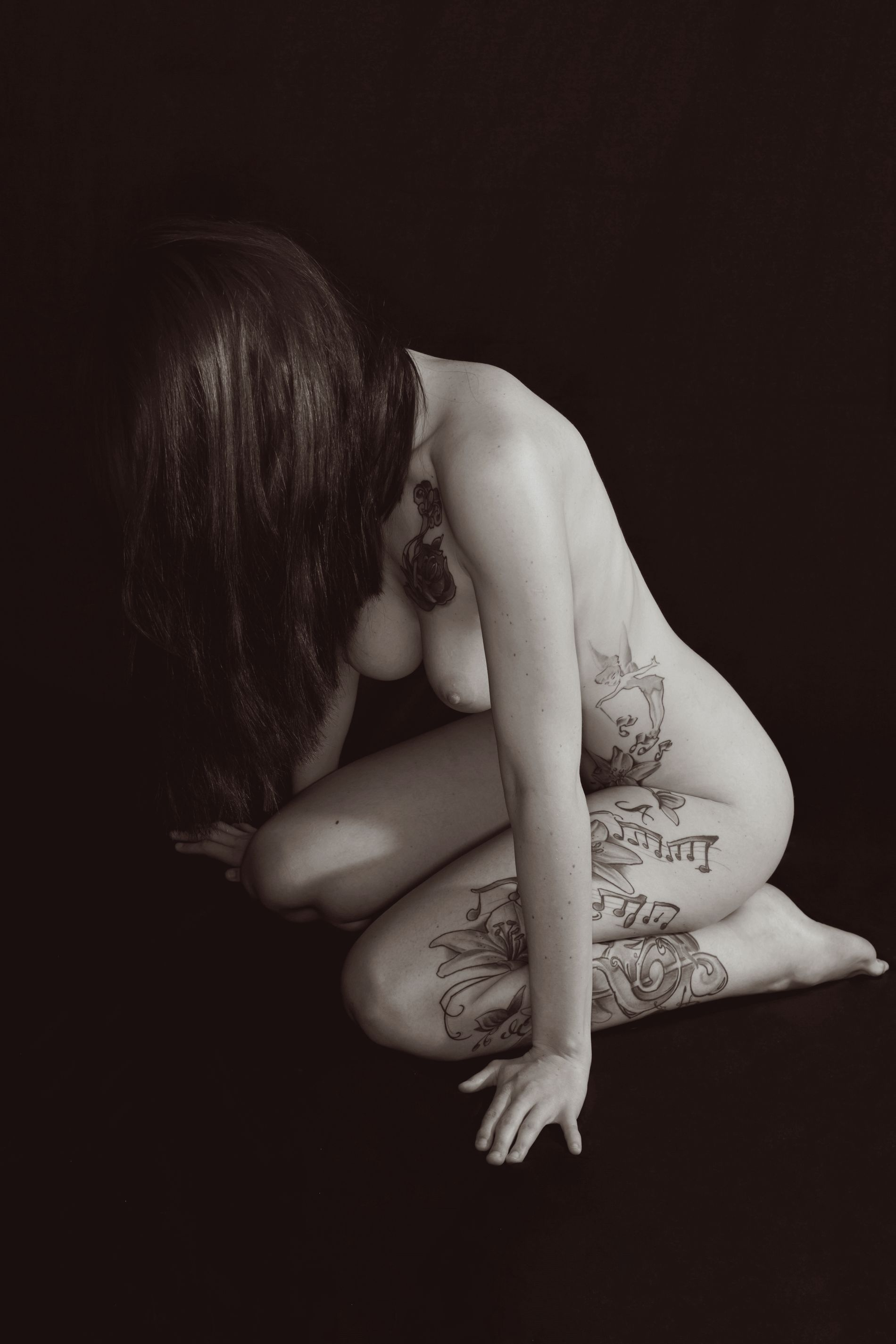 Redhead with Stunning Boobs Poses Nude