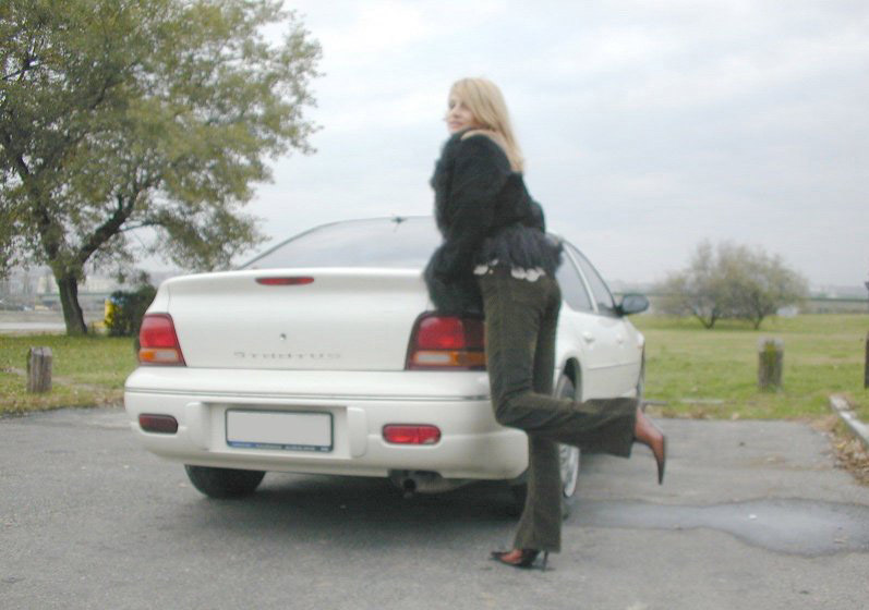 Wife Inserts Anal Toy in Car - Explicit Amateur Porn Photo