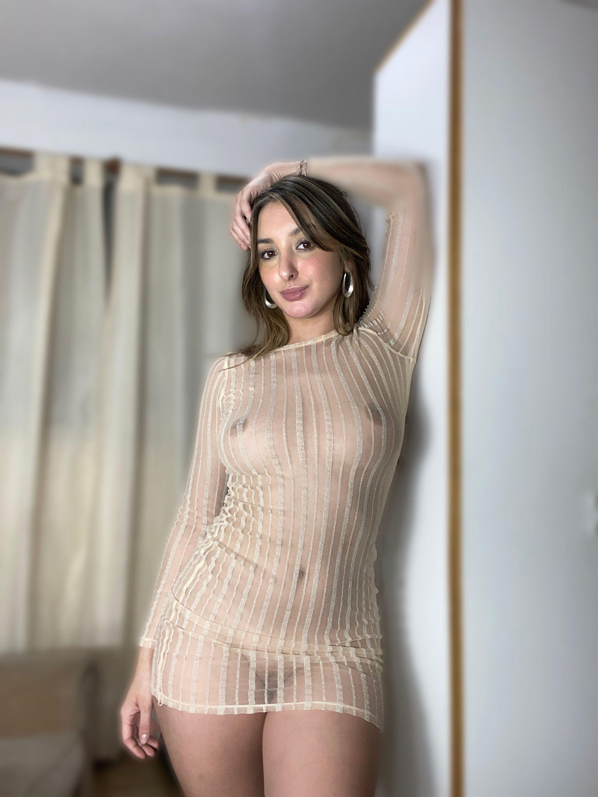 Long-haired brunette beauty flaunts her body and booty